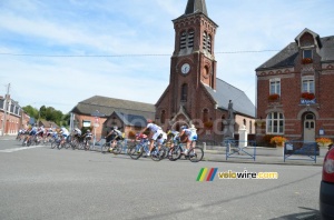 The peloton passes in front of the town hall and the church of Montay (2) (364x)