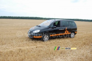 A Orange car in the middle of a big field! (327x)